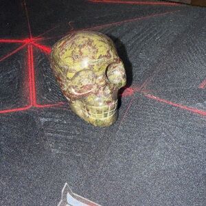 Green and Brown Stone Skull Decor
